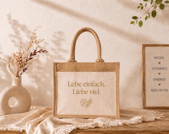 Jute bag with the saying "Live simply. Love much." – small cotton jute bag with Monstera design