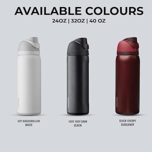 May include: Three insulated water bottles in white, black, and burgundy. The bottles have a sleek design with a flip-top lid. The text "AVAILABLE COLOURS" and size options are displayed above the bottles. The white bottle is labeled "SHY MARSHMALLOW WHITE".