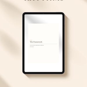 Pode incluir: Um planejador digital exibido em um tablet preto. A tela mostra o texto "The Framework" e uma descrição. Abaixo do tablet, há um retângulo marrom com o texto "28 PAGES PRINTABLE + FILLABLE PDF INSTANT DOWNLOAD". O fundo é bege claro.