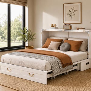 May include: A white wooden Murphy bed featuring a built-in headboard cabinet with side storage drawers. The bed is dressed with a light-colored mattress, a rust-colored throw blanket, a checkered runner, and several decorative pillows in rust and gray.