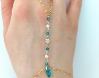 Cadena bicónica de turquesa, cuentas de nácar, circonita central, turquesa marquesa
