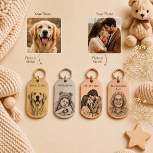 May include: Four oval metal keychains with engraved sketches based on photos. The first shows a dog with the text Born 12.03.2024, the second a baby with Hello Little One, the third a couple with 02.08.2023, and the fourth a person with Best Grandma Ever.