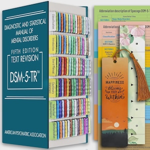 May include: A teal Diagnostic and Statistical Manual of Mental Disorders Fifth Edition Text Revision book with numerous colorful index tabs attached to the pages. Two decorative bookmarks with floral and sunset designs are placed next to the book.