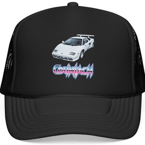 May include: Black trucker hat featuring a white sports car graphic and the word "COUNTIACH" in a retro font. The hat has a mesh back and a curved brim. A stylish accessory for car enthusiasts.