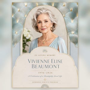 May include: A memorial service program featuring a portrait of a person with gray hair, wearing a light blue dress and gold necklace. The design includes a blue fan-patterned border and text reading In Loving Memory, Vivienne Elise Beaumont, 1956-2026.