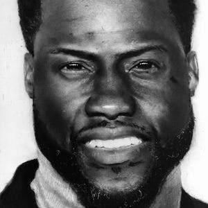 May include: A detailed black and white pencil portrait of a smiling man with a dark beard and short, dark hair. The portrait emphasizes the man's facial features, including his eyes, nose, and mouth.