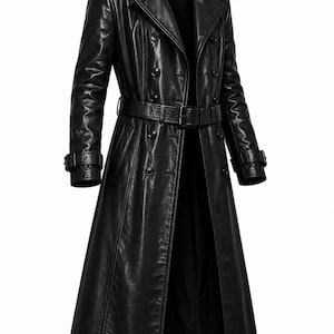 May include: A long, black leather trench coat with a double-breasted design. The coat features a wide collar, a belt at the waist, and button details. The sleeves have adjustable straps at the cuffs. A classic outerwear garment.