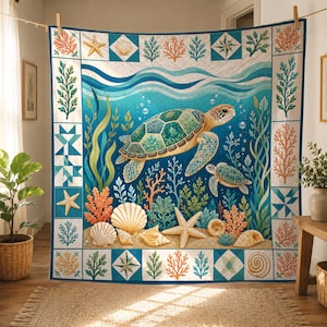 May include: A quilted wall hanging featuring an underwater scene with a large sea turtle and a smaller sea turtle swimming among coral, seaweed, and seashells. The central image is framed by a border of alternating squares with marine motifs.