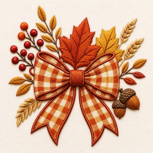 May include: An embroidered design featuring a central orange and white gingham bow surrounded by autumn elements including red berries, golden wheat stalks, brown acorns, and maple leaves in shades of orange, yellow, and deep red.