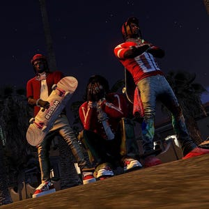 May include: Three people are posing outdoors at night. One holds a skateboard with the word "Wasted" on it. They are wearing red and white shirts, jeans, and red sneakers. The background includes palm trees and a dark sky.
