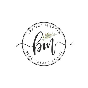 May include: A circular logo with the text "Brandi Martin Real Estate Agent" in a black font. The initials "bm" are in a cursive script, with a floral accent. The logo is on a white background.