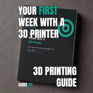 May include: A black instructional book titled Your First Week with a 3D Printer, featuring a teal circular target graphic on the cover. The text includes the subtitle Day-by-day guide from unboxing to confident maker by Andy Z-Offset, Guide 04.