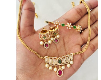Gold Plated Cubic Zirconia Lotus Necklace Set, Emerald Green Drop Choker, Faux Ruby Pendant, Delicate Floral Crystal Kada Bracelet Set