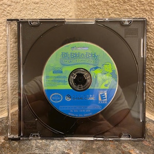 May include: A Nintendo GameCube video game disc for Ed, Edd n Eddy: The Mis-Edventures, housed in a clear plastic jewel case. The disc features a green and blue label with the game title, Midway logo, and an ESRB Everyone rating symbol.