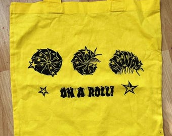 On A Roll yellow isopod tote bag // Lino-printed by hand