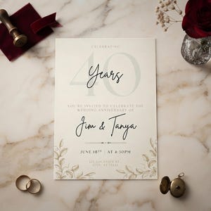 May include: A cream-colored wedding anniversary invitation card featuring the text Celebrating 40 Years, the names Jim & Tanya, and the date June 18th at 4:30 PM. The card is decorated with botanical line art and includes a wax seal and two gold rings.