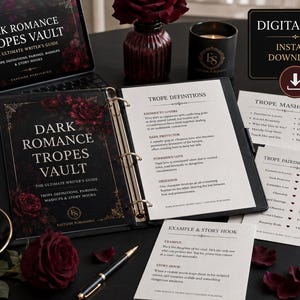 May include: A black binder containing pages titled Dark Romance Tropes Vault, featuring definitions, mashups, and pairings. The cover displays dark red roses and gold text. Additional printed cards and a digital tablet show the same title.