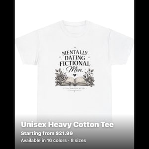 May include: A white short-sleeved t-shirt featuring a black graphic print. The design includes the text "MENTALLY DATING FICTIONAL Men." above an illustration of an open book flanked by two roses, with the text "IT'S COMPLICATED" below the book.