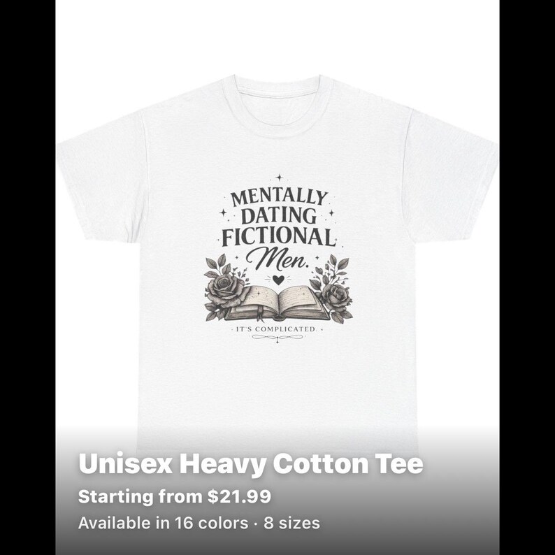May include: A white short-sleeved t-shirt featuring a black graphic print. The design includes the text "MENTALLY DATING FICTIONAL Men." above an illustration of an open book flanked by two roses, with the text "IT'S COMPLICATED" below the book.