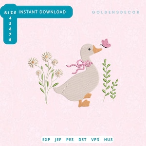 May include: An embroidery design featuring a light beige goose with an orange beak and feet, wearing a pink ribbon bow around its neck. The goose is surrounded by white daisies with green stems and a small pink butterfly. Text includes GOLDENSDECOR.