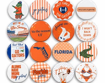 May include: A collection of sixteen round pinback buttons featuring University of Florida themes. Designs include a mascot, football stadium, gator illustrations, orange and blue patterns, and text such as Go Gators, Florida, and game day slogans.