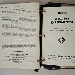 May include: Open binder with pages from "General Radio Experimenter" magazine. The left page lists visitors and company information. The right page is the index for volumes 30 and 31, June 1955 to May 1957, with the General Radio Company logo.