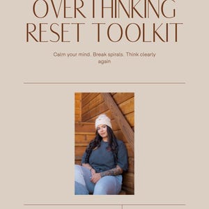May include: A workbook titled "OVERTHINKING RESET TOOLKIT" with the text "Calm your mind. Break spirals. Think clearly again." The cover is a light beige color with a photo of a person wearing a beanie and dark shirt. The author is AAMBER.