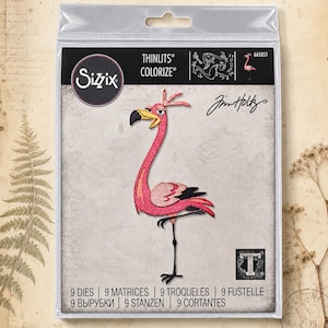 May include: A Sizzix Thinlits Colorize die set by Tim Holtz featuring 9 metal dies to create a layered pink flamingo figure. The packaging displays the brand logo, the product name, and a graphic of the assembled flamingo with a black beak and legs.