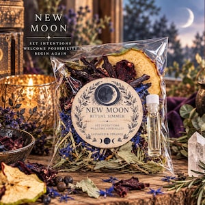 May include: A clear plastic bag containing a New Moon Ritual Simmer blend of dried herbs, blue flower petals, and dried fruit slices. A circular label features the text New Moon Ritual Simmer, Set Intentions, Welcome Possibility, Salvaged & Strange.