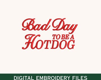 May include: Red text on a cream background reads "Bad Day to be a Hotdog." Below the text is a green banner with the words "DIGITAL EMBROIDERY FILES" and file type abbreviations.