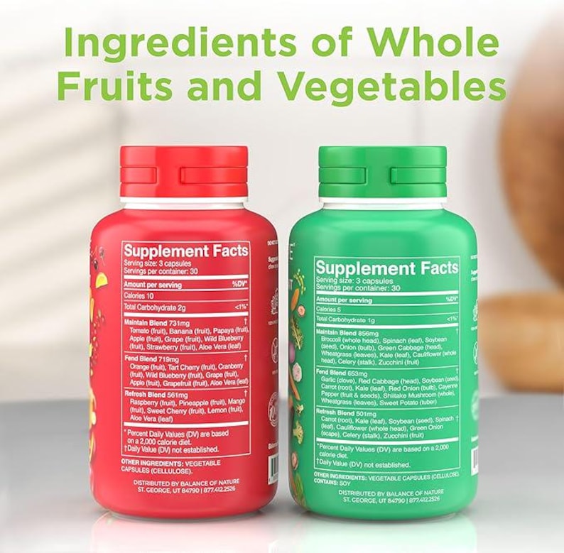 May include: Two supplement bottles, one red and one green, with white labels detailing ingredients and nutritional information. The text "Ingredients of Whole Fruits and Vegetables" is at the top. The red bottle lists various fruit ingredients, while the green bottle lists vegetables.