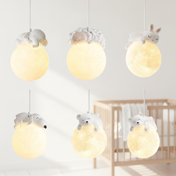 A resin-cast sleeping bunny curled inside a crescent moon, hand-sculpted and wired as an actual ceiling pendant — genuinely one-of-a-kind nursery art you won't find at IKEA.