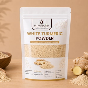 May include: A white stand-up pouch of Alamee brand organic white turmeric powder. The label features the text White Turmeric Powder, 100 grams net weight, and ingredient details. The pouch is surrounded by fresh white turmeric roots and powder.