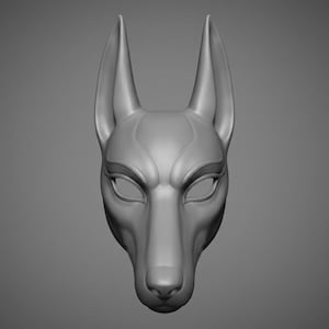 May include: A smooth, matte gray mask featuring the stylized head of a canine with tall, pointed ears and almond-shaped eye openings. The design includes defined facial contours, a narrow snout, and a nose, presented in a neutral, solid color.