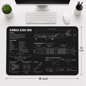 May include: A black rectangular desk mat featuring a white technical blueprint of an Airbus A350-900 aircraft. The design includes side and top views, cabin configuration, engine details, and flight data. The mat measures 12 inches by 18 inches.
