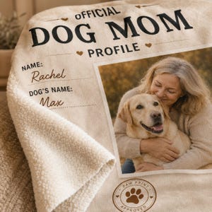 Woman holding a personalized Dog Mom blanket to show the size and soft fleece drape.