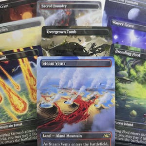 May include: A collection of Magic: The Gathering trading cards featuring full-art illustrations. The cards displayed include Blood Crypt, Sacred Foundry, Temple Garden, Overgrown Tomb, Watery Grave, Stomping Ground, Steam Vents, and Breeding Pool.