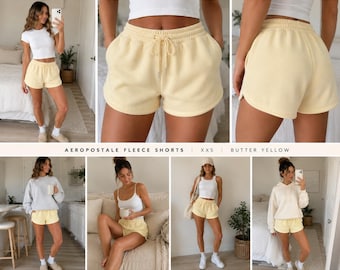 Pantaloncini Aeropostale da donna XXS, gialli, in misto cotone felpato con motivo a delfini e tasche.
