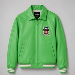 May include: A bright lime green leather jacket featuring a full-length front zipper, a classic collar, and ribbed cuffs and hem with white stripes. An embroidered patch on the chest displays the text AVIREX above a shield with a US flag design.
