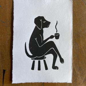 original black coffee drinking dog linocut art