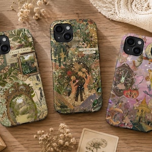 May include: Three rectangular smartphone cases featuring intricate collage designs. The left case displays a green garden scene with a mirror frame and the text "fairy tale." The center case shows a dark forest motif with the text "I intend to live, not just exist." The right case features a purple fantasy landscape with fairies and mushrooms.