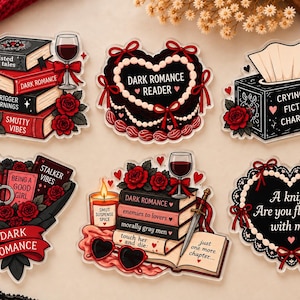 May include: A set of six die-cut stickers featuring dark romance themes. Designs include stacks of books with red roses, a heart-shaped cake, a tissue box labeled Crying Over Fictional Characters, and a heart with the text A knife? Are you flirting with me?