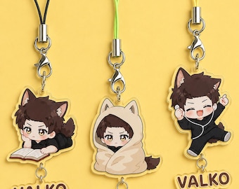 May include: Three acrylic charms featuring cartoon characters with animal ears, each attached to a colored cord with a metal clasp. Each charm includes a smaller dangling acrylic piece with the text VALKO in brown letters on a light background.