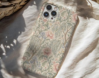 May include: A smartphone case featuring a detailed botanical pattern with soft pink peonies, light blue irises, and sage green willow branches on a cream background. The case has a cutout for a triple-lens camera system on the upper left side.