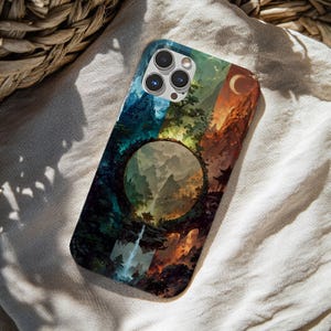 May include: A rectangular smartphone case featuring a vibrant, split-toned landscape illustration. The design depicts a circular portal framing a mountain scene with a waterfall, transitioning from cool blue tones on the left to warm orange hues on the right.
