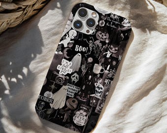 May include: A black and white phone case featuring a collage of Halloween-themed imagery including ghosts, skeletons, pumpkins, a skull, a camera, and text elements such as "BOO!", "I'm a fall kind of girl", "What's your favourite scary movie?", and "Eye of Newt".