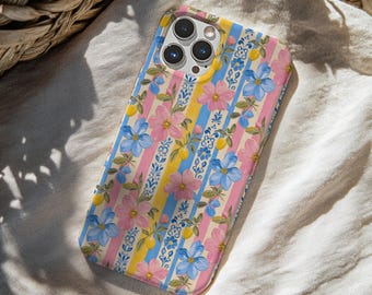 May include: A smartphone case featuring a vertical striped pattern in light blue, yellow, and pink. The design is decorated with a floral motif of pink and blue flowers, green leaves, small yellow lemons, and intricate blue and white scrollwork.