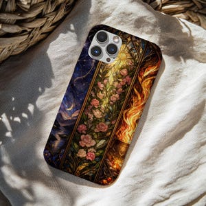 May include: A rectangular phone case featuring a three-panel design. The left panel shows a dark blue night sky with a crescent moon. The center panel displays pink roses and green vines. The right panel depicts bright orange and yellow flames.