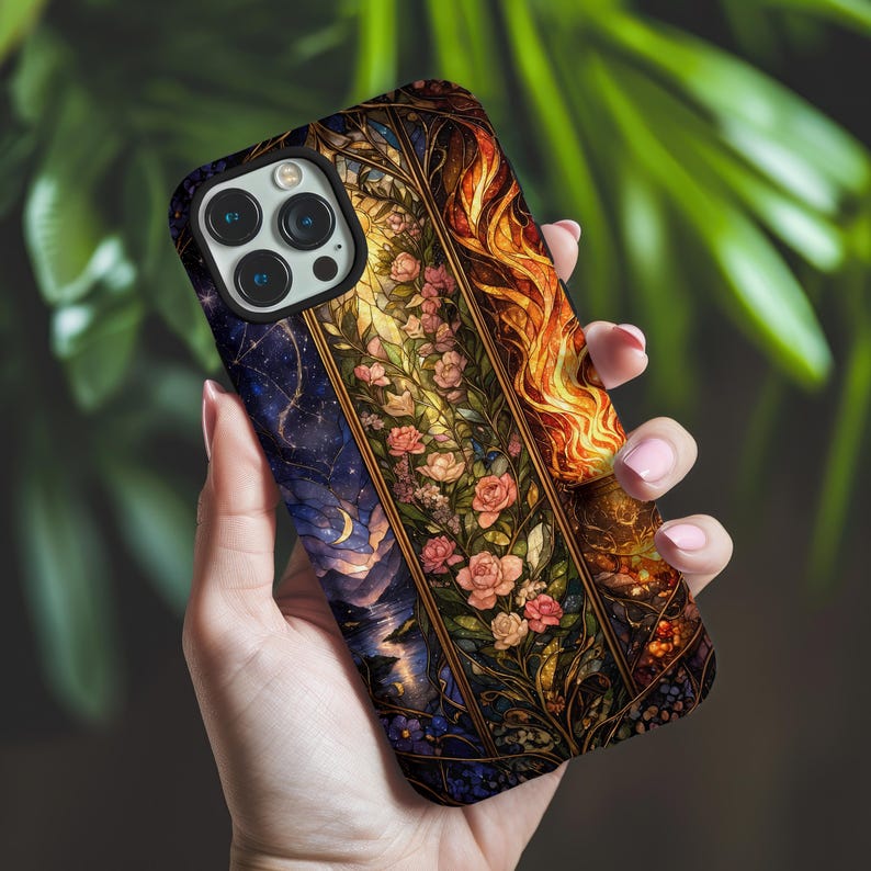 May include: A smartphone case featuring a vertical design with a dark blue starry night sky on the left, a central panel of pink roses and green foliage, and a vibrant orange and yellow flame pattern on the right side with a black camera cutout.