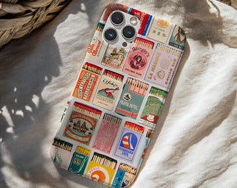 May include: A smartphone case featuring a collage of vintage matchbox designs. The colorful graphic print displays various rectangular matchbox labels with text including Barnaby's Prime Rib, Fujiya Hotel, Starboard Tack, and La Nadine Caviar Bar.
